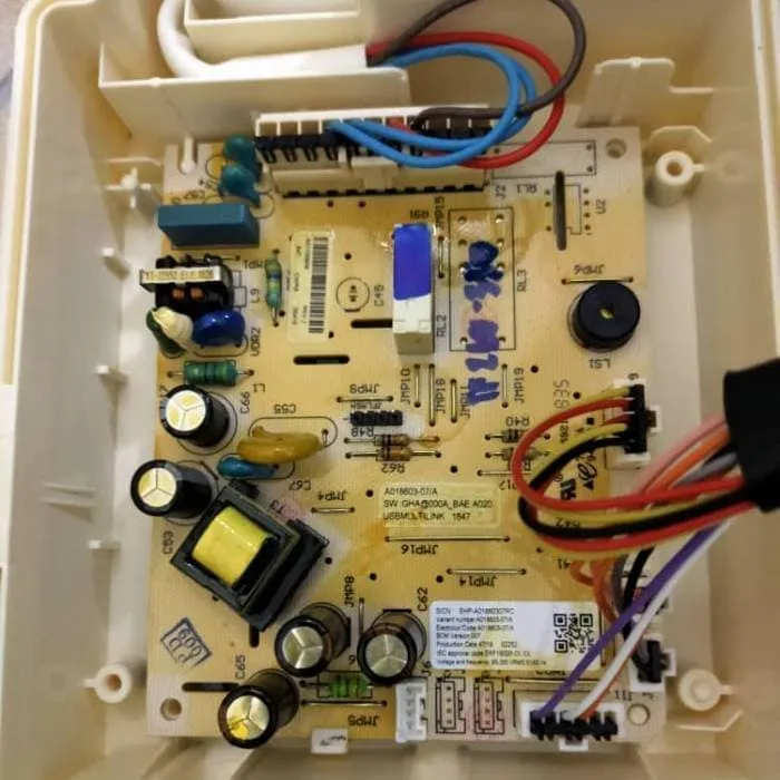 Technician repairing main control board of refrigerator