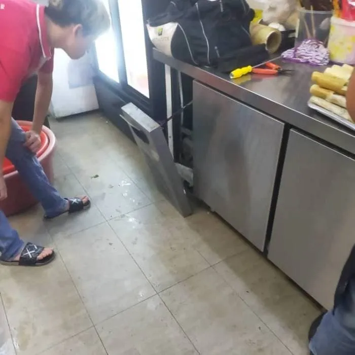 Undercounter fridge repair in kitchen